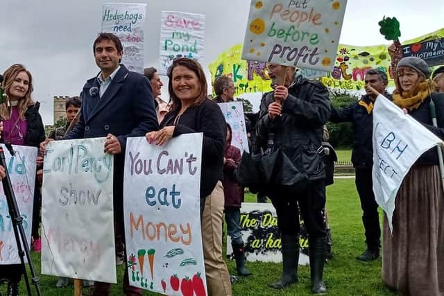 Isleworth councillors Salman Shaheen And Sue Sampson protest against the Duke of Northumberland's plans to build housing on the Park Road Allotments in London outside the Duke's London residence, Syon House