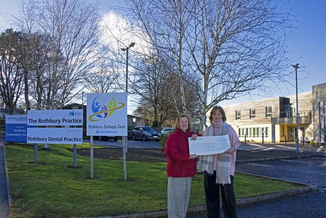 Susan Aynsley presenting Cathy Jacobs from the Coquetdale League of Friends with a cheque.