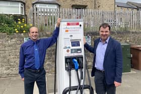 Coun John Riddle, cabinet member for improving our roads and highways, and Guy Opperman MP at a county council EV charge point.