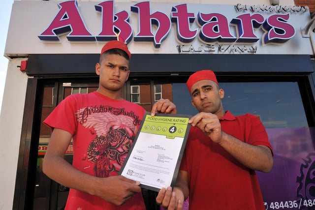 Akhtars takeaway recieved a four star food hygiene rating, pictured with the certificate are staff members Ateek Rafiq and Muhammad Jahangir in 2011