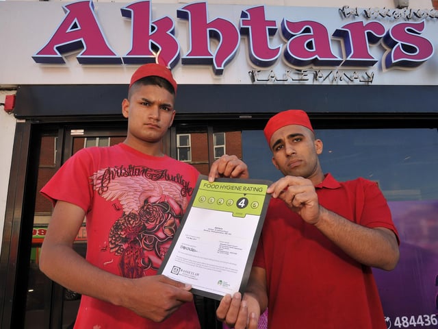 Akhtars takeaway recieved a four star food hygiene rating, pictured with the certificate are staff members Ateek Rafiq and Muhammad Jahangir in 2011
