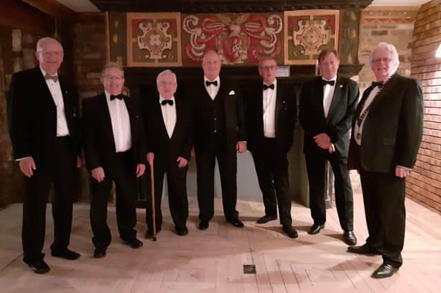 From left, long service chevrons Chris Offord, Richard Short, Eddy Gebhard, Harry Cone, Peter Crook, Alan Benson and Les Sage.