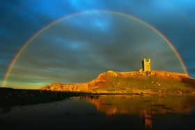 File picture of a rainbow over Dunstanburgh Castle. Photograph by Jane Coltman.
