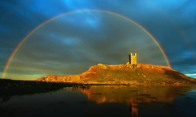File picture of a rainbow over Dunstanburgh Castle. Photograph by Jane Coltman.