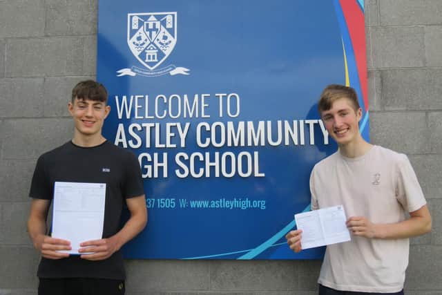 Students at Astley Community High School celebrate their GCSE results.