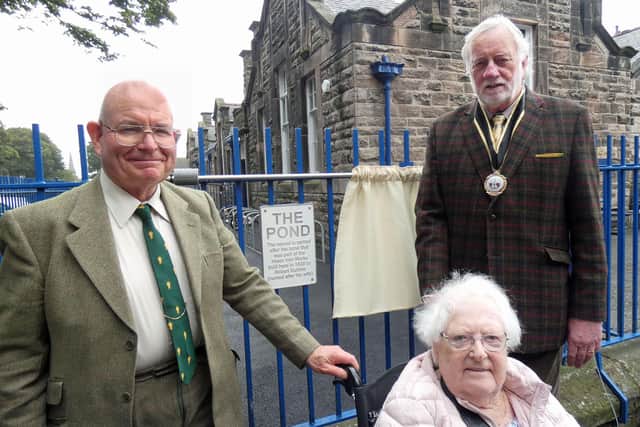 Robert Ashworth, Elsie Turnbull and Coun Mike Greener next to ‘The Pond’ plaque.