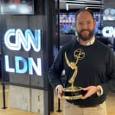James Frater with his Emmy award at the CNN London office.
