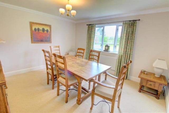 The dining room is a good-sized multipurpose room with a window overlooking the rear garden.