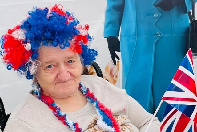 One of the care home residents dressed up in red, blue and white colours.