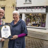 Helen McKenzie from Alnwick Vintage and Antique is presented with a certificate from Mayor Geoff Watson.