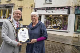 Helen McKenzie from Alnwick Vintage and Antique is presented with a certificate from Mayor Geoff Watson.