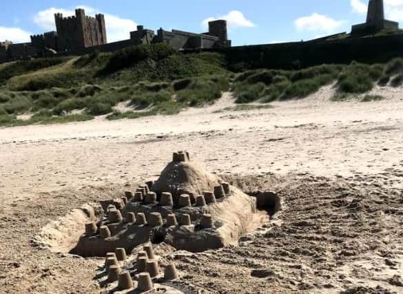 A sandcastle by Bamburgh Castle.