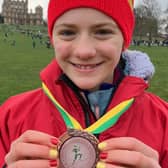 Emilia Waugh with the team bronze medal she helped the North East U13 girls team win. Picture: Joe Waugh