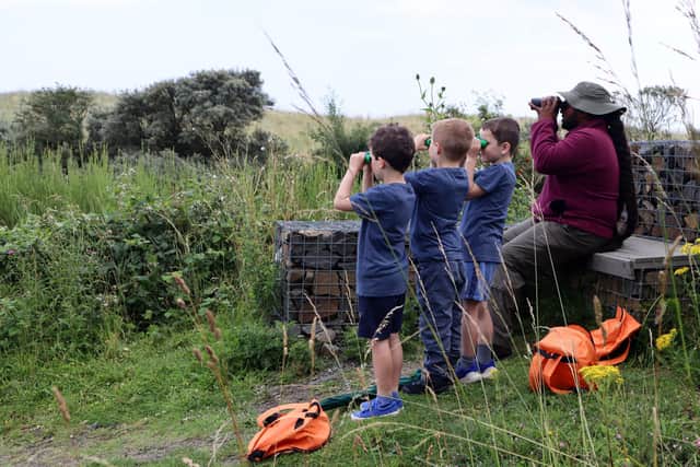 Ranger Hamza and the ramblers looking for owls at Hauxley Nature Reserve. (Photo by BBC Studios)