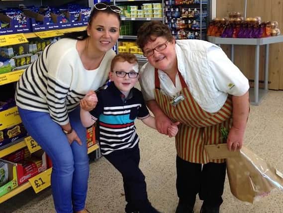 Aimee Reeves and her son Logan with Caroline Bisset, a member of staff at Morrisons in Alnwick.
