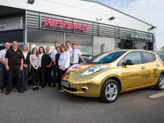 The gold Nissan Leaf calls in at Blackshaws of Alnwick.