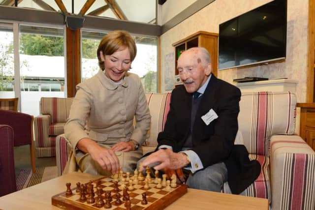 The Duchess of Northumberland learns some chess moves from Derek Ward in the drop-in centre. Picture by Jane Coltman