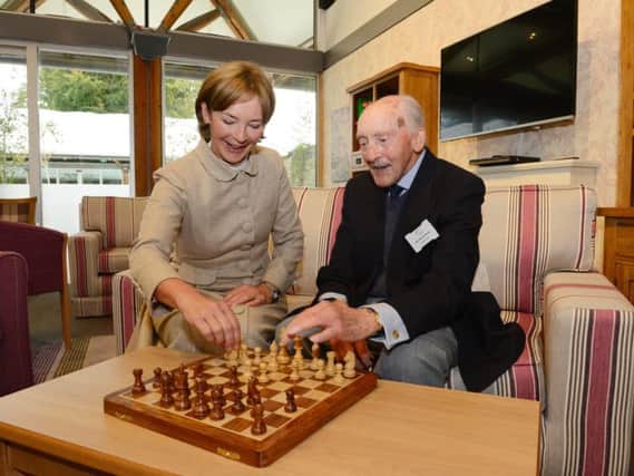 The Duchess of Northumberland learns some chess moves from Derek Ward in the drop-in centre. Picture by Jane Coltman