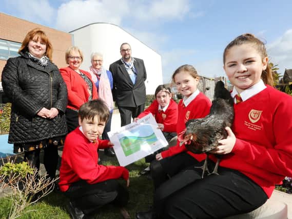 Nicola Wardle, from Northumberland County Council; Clare Marriott and Pat Parker, from Josephine Butler Primary Campus; and Coun Alan Sambrook, civic head of Northumberland County Council with pupils Callum Pringle, Rebecca Brown, Libby Rees and Grace Strong (holding Susan the chicken).