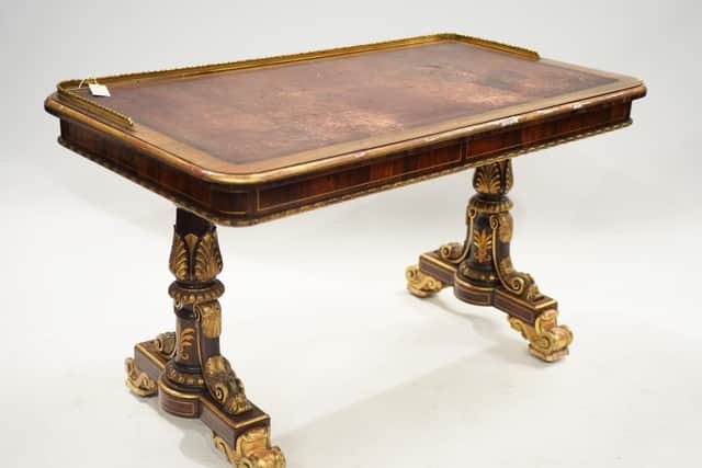 Lot 336: The Regency rosewood and parcel gilt writing table.
