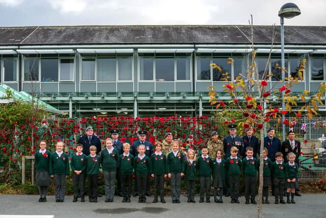 Pupils and representatives from RAF Boulmer at the Remembrance service at St Paul's RCVA Primary School. Picture by Colin Graham, courtesy of RAF Boulmer.