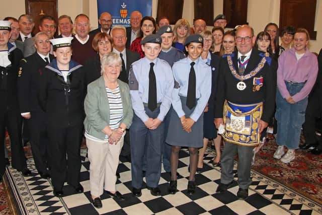 Ian Craigs, the Provincial Grand Master of Northumberland, with award recipients.