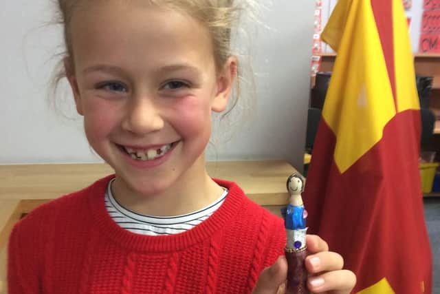 A pupil shows off her Northumberland Day creation at Whittingham Primary.