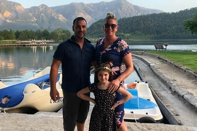 Zac and Karen Scott and their daughter, Lexie, at Lake Levico in Italy.