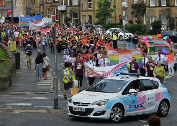 The Northumbria Police LGBT+ car and the Co-op Funeralcare rainbow hearse at the head of the march. Picture by Steve Miller