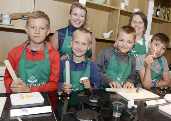 The youngsters from Belarus enjoy their cookery classes at Outcook in Alnwick. Picture by Jane Coltman