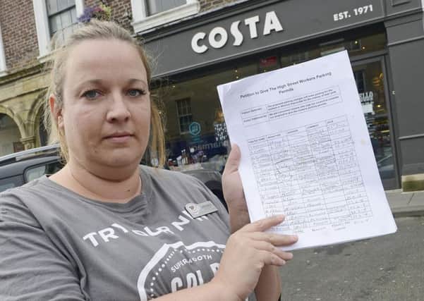 Laura Baile, the manager of Costa in Alnwick, with the parking petition. Picture by Jane Coltman