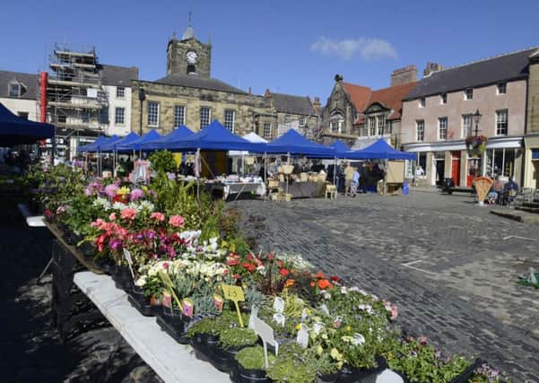 The Saturday market in Alnwick Market Place. Picture by Jane Coltman