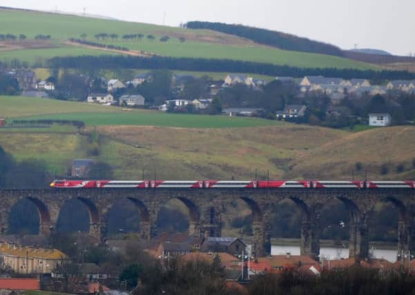 A train makes its way over the Royal Border Bridge on the East Coast Main Line, south of Berwick station.