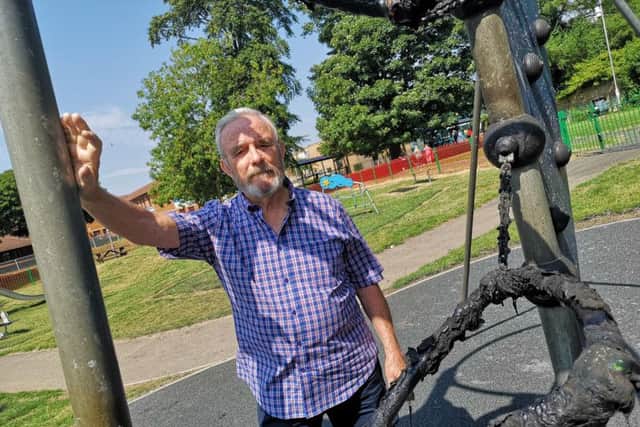 John Collins, chairman of Cramlington Town Council, with a piece of equipment in the play park that was set alight. Pictures by Jane Coltman.