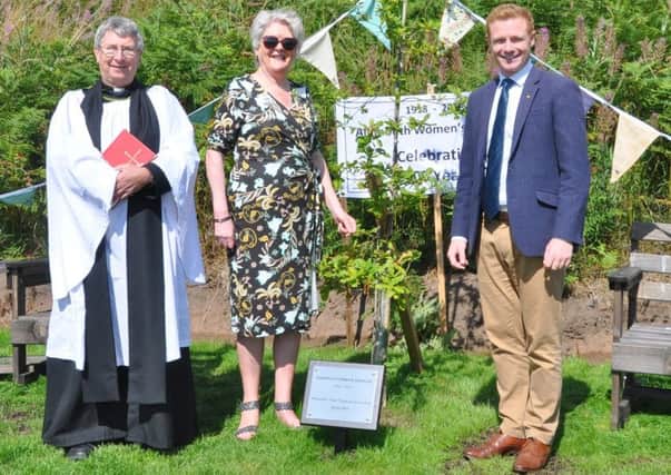 The Rev Ian MacKarill, Alnmouth WI president Janis Crook and Coun Robbie Moore at the tree dedication ceremony. Picture by Terry Collinson