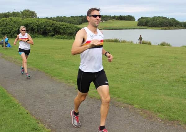 Alnwick Harriers Phil Hall and Justine Norman in the Druridge Bay parkrun.