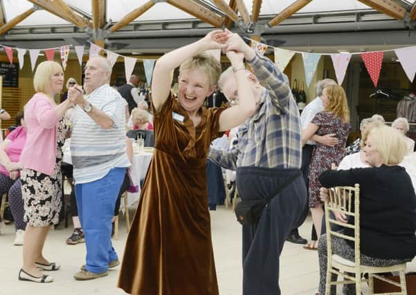 Tracy Jones, Elderberries coordinator, gets into the swing of things at the summer party. Picture by Jane Coltman