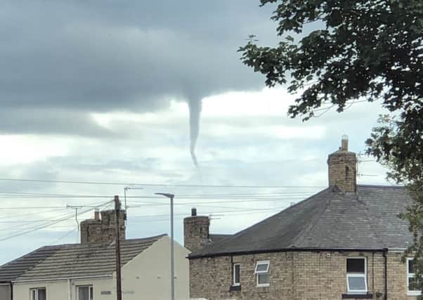 The funnel cloud above Amble. Picture by Tom Stewart