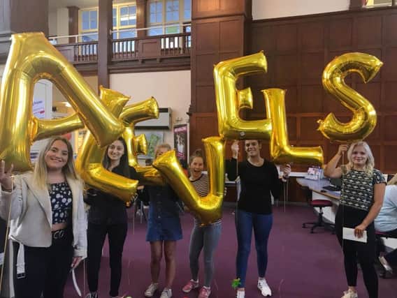 Queen Alexandra Sixth Form College students celebrate their exam success.