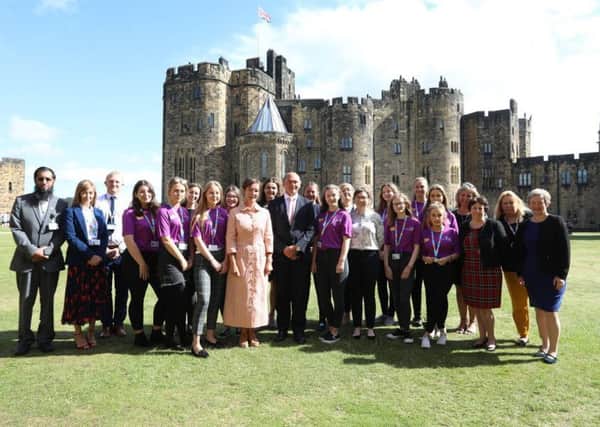 The launch of the scheme at Alnwick Castle. The Duchess of Northumberland and the volunteers are among those who are pictured.