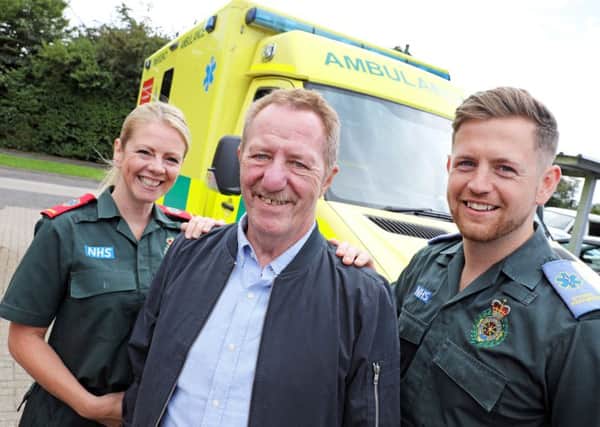 Stan Charman with paramedic Paula Treadwell and student paramedic Dan Peake. Picture by Helen Smith.
