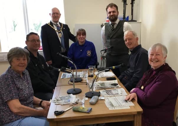 Mayor Alan Symmonds and Grant Welch, from Specsavers, with volunteer readers Lorna Ternent, Gillie Stapleton and Ernie Harpur and Lions Mick Keane and Sandra Shepherd recording a recent edition.