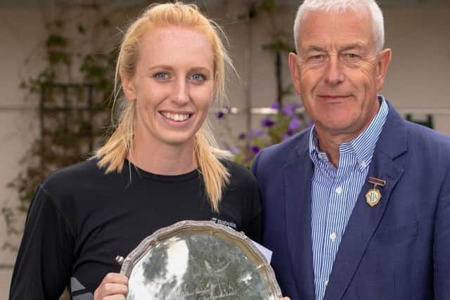 Emma Wilson receives the Northumberland Open Womens Singles trophy.