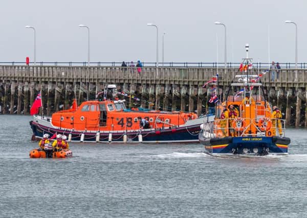 Lifeboat hat-trick - Amble's Shannon class Elizabeth and Leonard and inshore boat Mildred Holcroft, with former lifeboat Charles Henry, which was visiting for the day. Picture by Andrew Mounsey