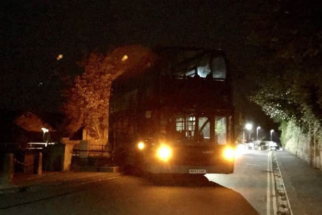 Call for company to change route as bus gets stuck in railings