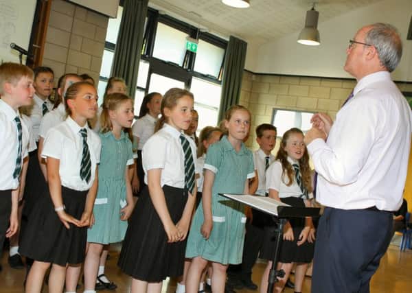 Students at Bede Academy, Blyth, upper school choir bring their summer concert to a
close led by departing head of music David Tallent