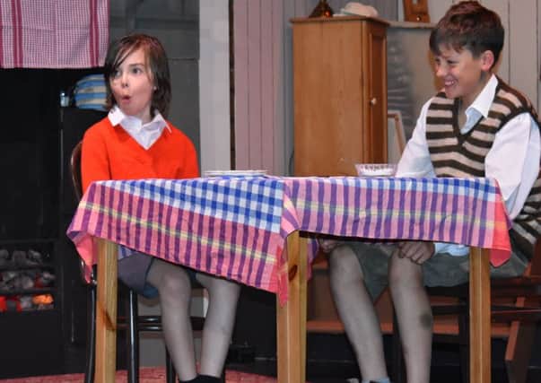 Archie Braid as Zach (left) and Cameron Cullen as William Beech (right) in Goodnight Mister Tom.