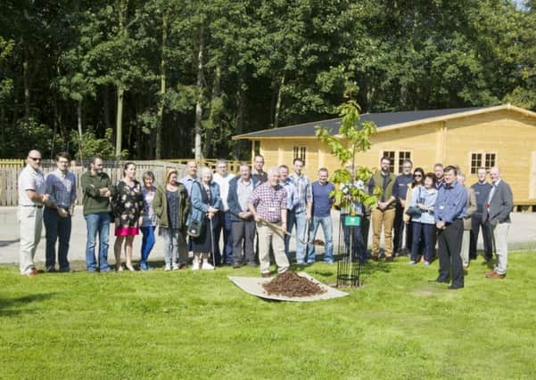 A tree is planted at the new Woodland Centre at Kirkley Hall to commemorate the launch of the Northumbria Veteran Tree Project.