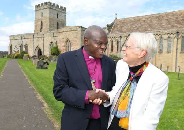 The Archbishop of York, Dr John Sentamu with Seahouses resident Linda Thorburn at St Aidan's Church in Bamburgh. Picture by Crest Photography