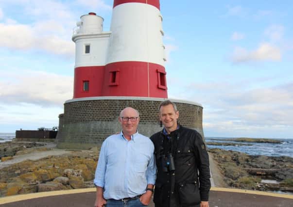 TV presenter Alexander Armstrong on a visit to the Farne Islands with boat skipper George Shiel.